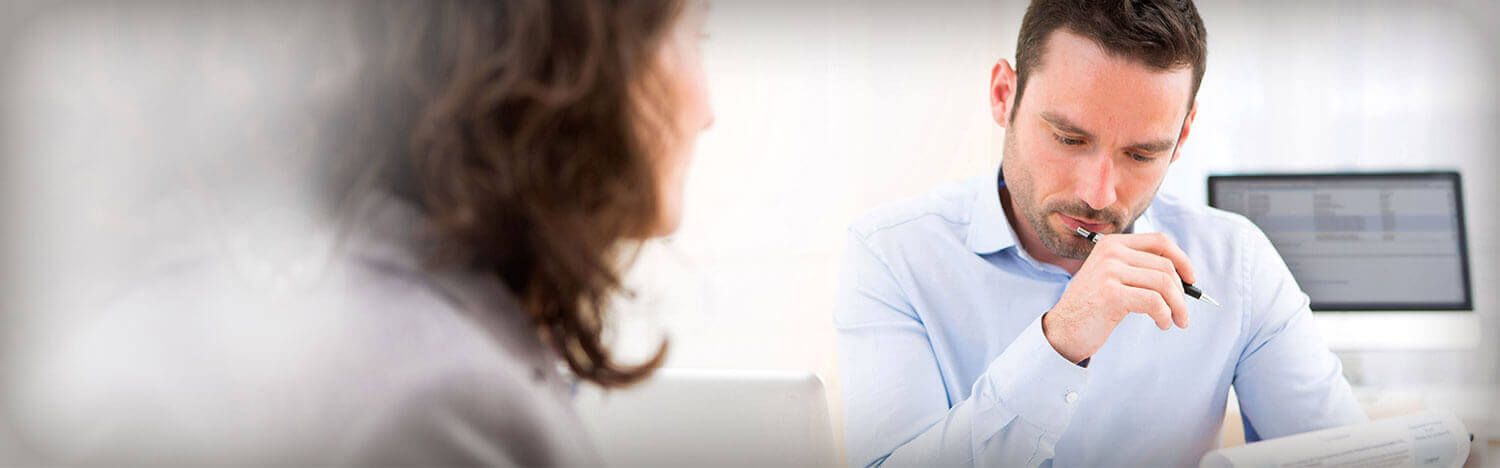 2 business professionals reviewing paperwork